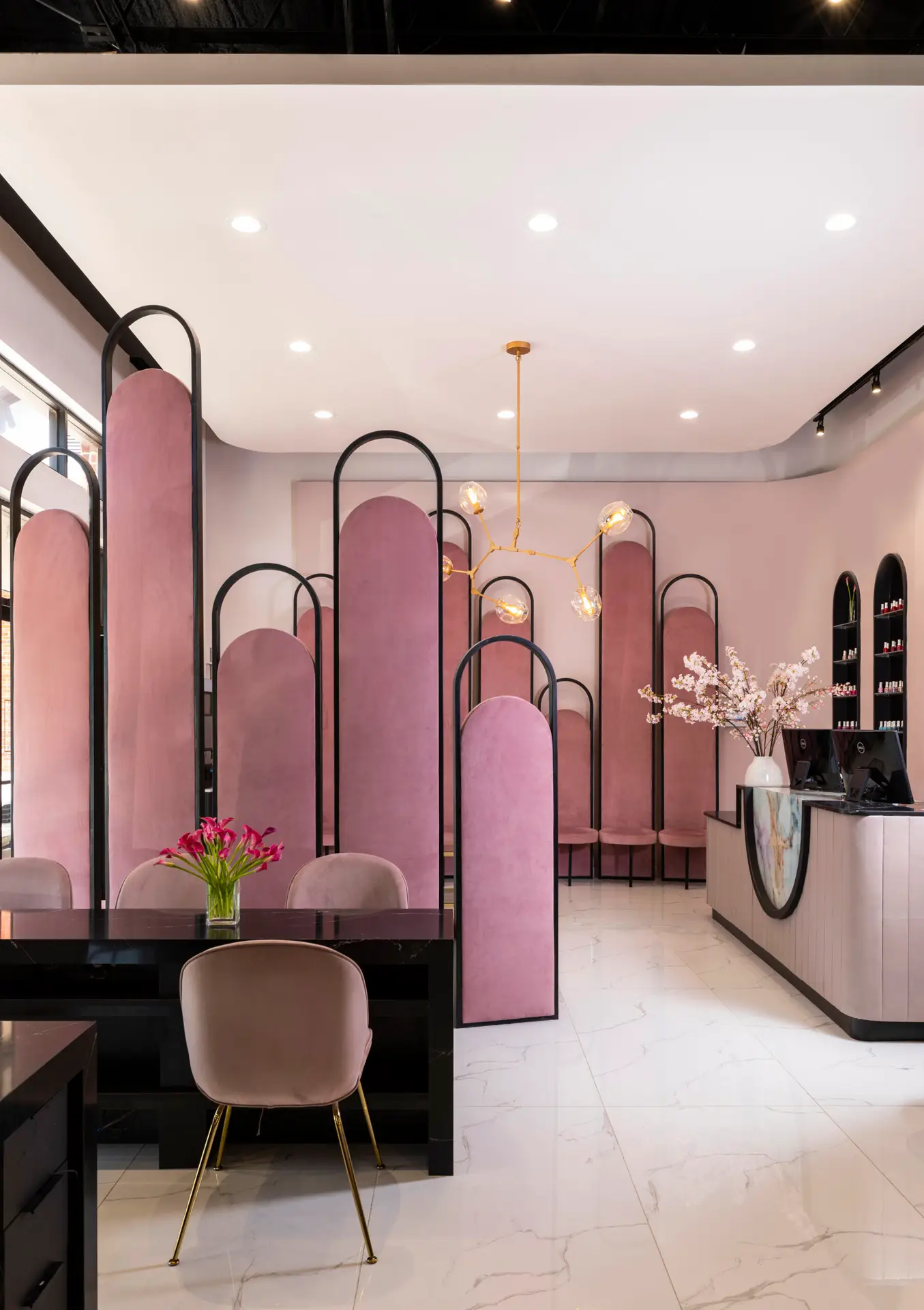 Gloss Nail Bar pink velvet interior with chandelier