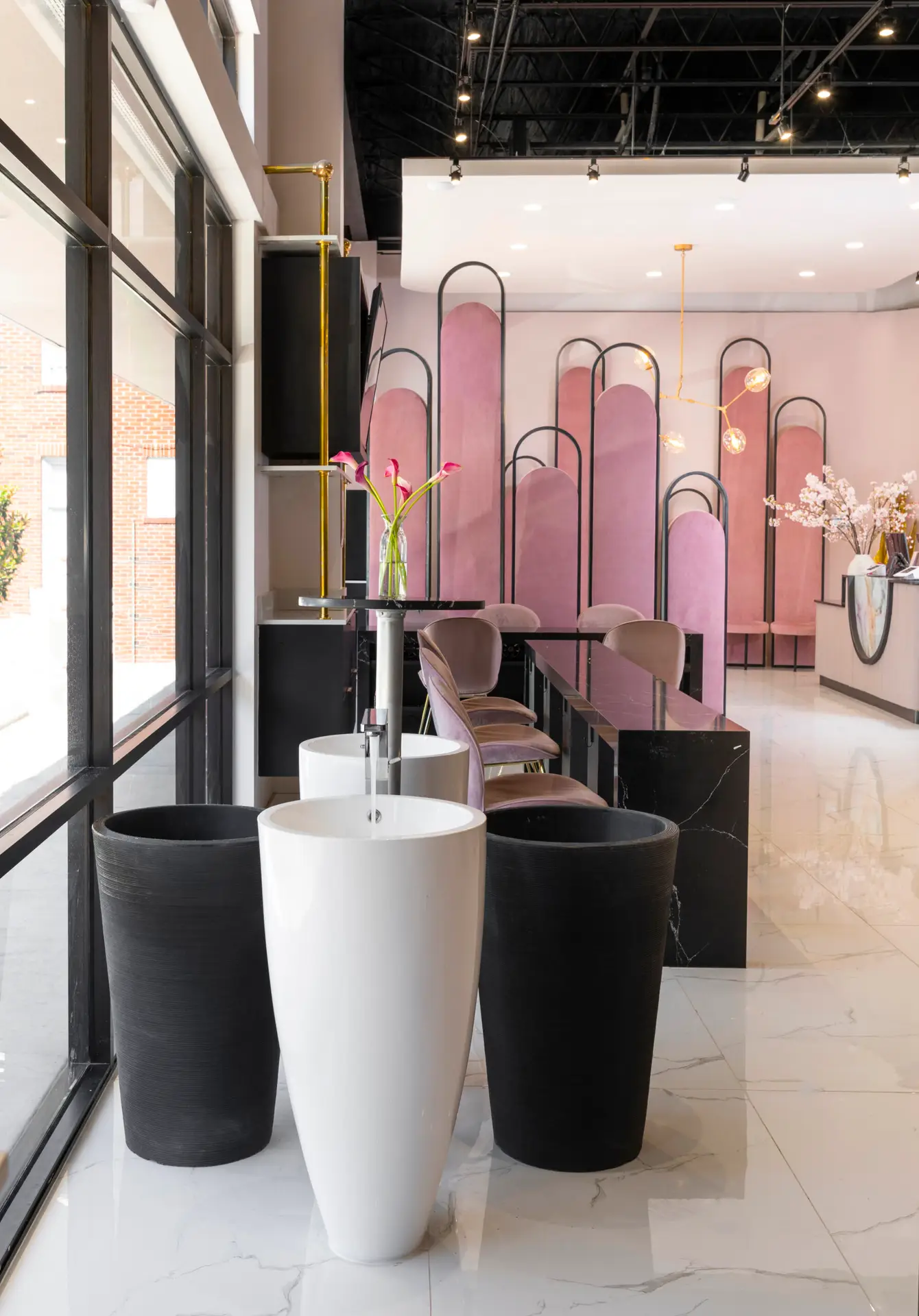 Pink velvet arch waiting area at Gloss Nail Bar Houston